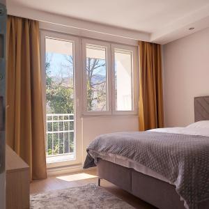 Кровать или кровати в номере Apartman Neyla