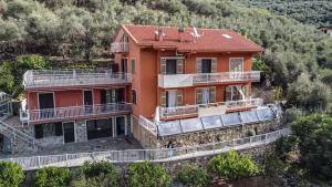 an aerial view of a house on a hill at Agriturismo La Rocca in San Bartolomeo al Mare