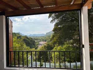 a window with a view of a mountain view at Casa AguaMarina in Honda