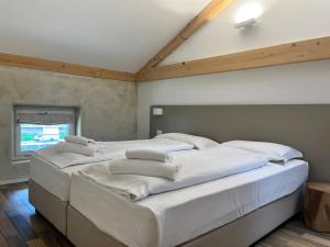 A bed or beds in a room at Albola Suite Holiday Apartments