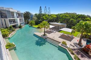 an aerial view of a swimming pool in a building at Drift Apartments - Tweed Coast Holidays ® in Kingscliff