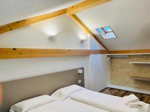 A bed or beds in a room at Albola Suite Holiday Apartments