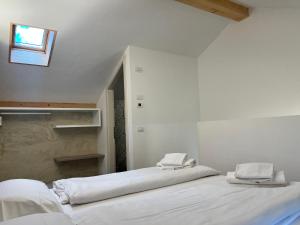 A bed or beds in a room at Albola Suite Holiday Apartments