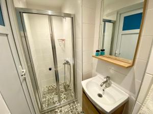 a bathroom with a shower and a sink at MBAS Apartments in Istanbul