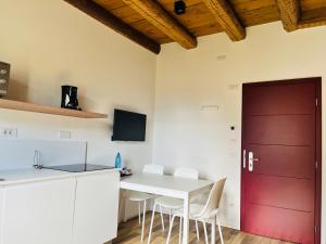 A kitchen or kitchenette at Albola Suite Holiday Apartments