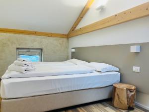 A bed or beds in a room at Albola Suite Holiday Apartments