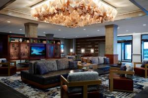 a lobby with couches and a large chandelier at Washington Marriott Georgetown in Washington, D.C.