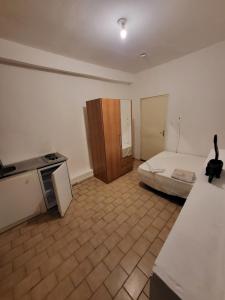Ένα ή περισσότερα κρεβάτια σε δωμάτιο στο Studio au rez de chaussée