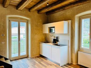 A kitchen or kitchenette at Albola Suite Holiday Apartments