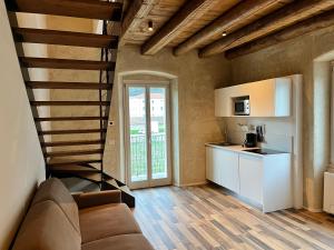 A kitchen or kitchenette at Albola Suite Holiday Apartments