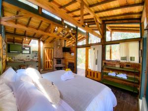 Cama o camas de una habitación en Suite Cabaña Cantodeagua-Jacuzzi