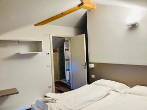 A bed or beds in a room at Albola Suite Holiday Apartments