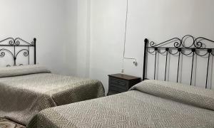 Posteľ alebo postele v izbe v ubytovaní CASA FUENTE DEL MOLINO DE LA IRUELA + 2 fotografie