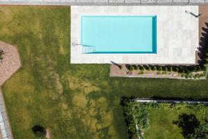 an overhead view of a swimming pool in a yard at Justina 7 Apartments in San Paolo