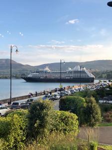 a cruise ship is docked in a parking lot at Great Georges Duplex Apt In association with Great Georges house for larger group in Warrenpoint