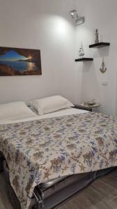 A bed or beds in a room at La piccola Perla