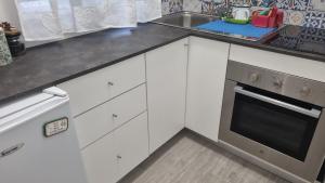 A kitchen or kitchenette at La piccola Perla