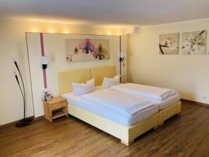 Postel nebo postele na pokoji v ubytování Hotel Rheingraf