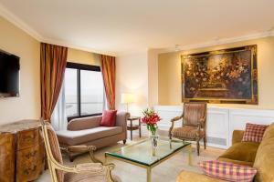 a living room with a couch and a table at Sheraton Buenos Aires Hotel & Convention Center in Buenos Aires