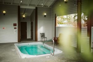 a jacuzzi tub in the backyard of a house at Friday Harbor Suites in Friday Harbor