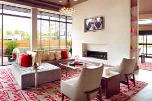 a living room with a couch and a fireplace at Residence Inn by Marriott Columbus OSU in Columbus