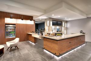 a kitchen with a large island in a room at Courtyard by Marriott Los Angeles LAX/Hawthorne in Hawthorne