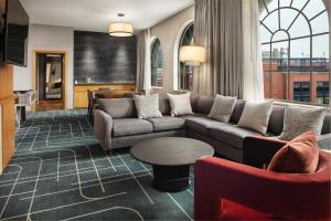 a living room with a couch and a table at The Westin St. Louis in Saint Louis