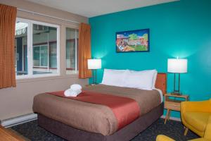 Postel nebo postele na pokoji v ubytování Bowmont Motel + 37 fotografií