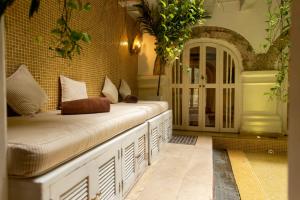 Postel nebo postele na pokoji v ubytování Leones de Alba Hotel Boutique