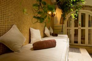 Postel nebo postele na pokoji v ubytování Leones de Alba Hotel Boutique
