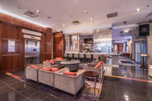 a lobby with couches and a bar in a building at Courtyard Chicago Downtown/Magnificent Mile in Chicago