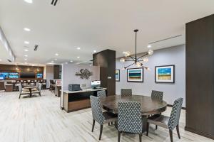 a dining room with a table and chairs at TownePlace Suites by Marriott Austin Northwest The Domain Area in Austin