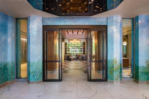 an entrance to a building with glass doors at JW Marriott Atlanta Buckhead in Atlanta