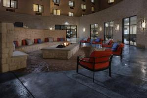 a lobby with a fire pit in a building at Courtyard by Marriott Austin Pflugerville in Pflugerville