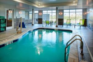 a large swimming pool in a hotel lobby at Fairfield Inn & Suites by Marriott Columbus, IN in Columbus