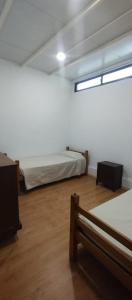 Un ou plusieurs lits dans un hébergement de l'établissement Casa en colonia para 7 personas