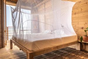 Postel nebo postele na pokoji v ubytování Mendihuaca Surf Camp