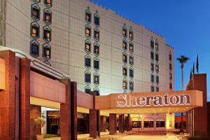 a hotel building with a sheraton sign in front of it at Sheraton Riyadh Hotel & Towers in Riyadh