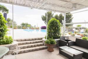 Πισίνα στο ή κοντά στο Villa con piscina con 8 camere matrimoniali ad Anacapri, by La Canostra Capri