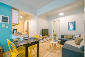 a living room with a couch and a table at cozy couple retreat in Kalamata