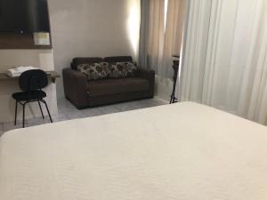 Postel nebo postele na pokoji v ubytování Hotel de Minas