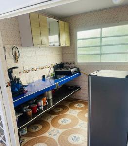 a small kitchen with a sink and a stove at Casa con piscina in El Colegio