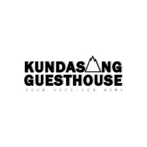 una señal que dice pensión Kundasang en Kundasang Guesthouse, en Kampong Kundassan
