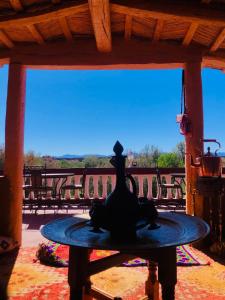 a statue of a bird sitting on a table at kasbah amlal in Tinerhir