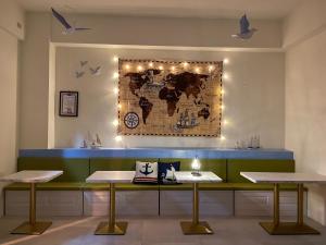 a restaurant with a map of the world on the wall at 航海途民宿 in Hui-min-erh-ts'un