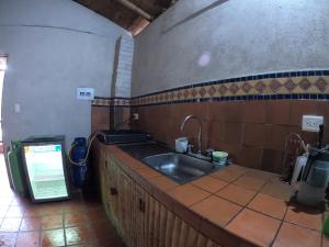 a kitchen with a sink and a counter top at RESERVA ANDINA in Piedecuesta +40 photos