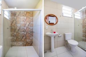 a bathroom with a toilet sink and a mirror at Pousada Shiva in Japeri
