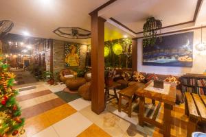 a living room with a christmas tree and a couch at Natura Vista in Panglao