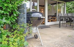 a grill sitting on the side of a house at Viscum in Arnager