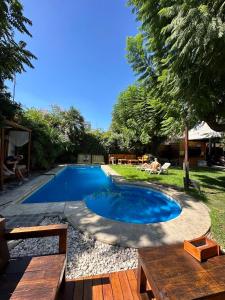 a swimming pool in the yard of a house at Gorilla Hostel in Mendoza